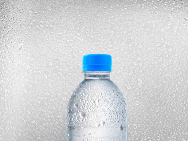 istock water bottle on water droplets background 1397930729