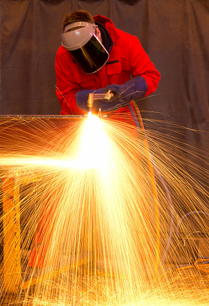 istock Welder in red creates huge  orange sparks 139793096
