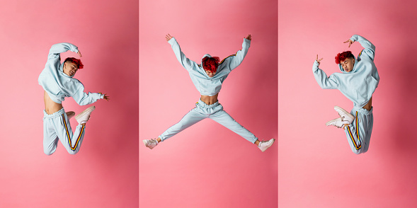 A composite image of portraits of a teenage male jumping in mid air and creating shapes with his body while posing for the camera. He is posing in front of a pink background.