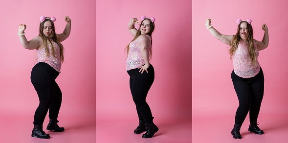 A composite image of portraits of a young woman with Down Syndrome dancing and having fun while wearing a headband with fluffy balls attached. She is dancing in front of a pink background.