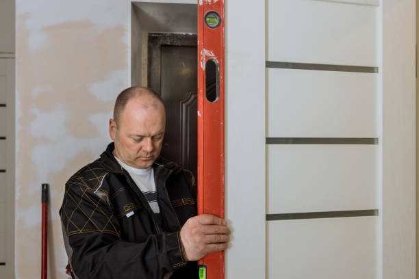 istock Renovation home on carpenter at interior wood door installation working 1397933421
