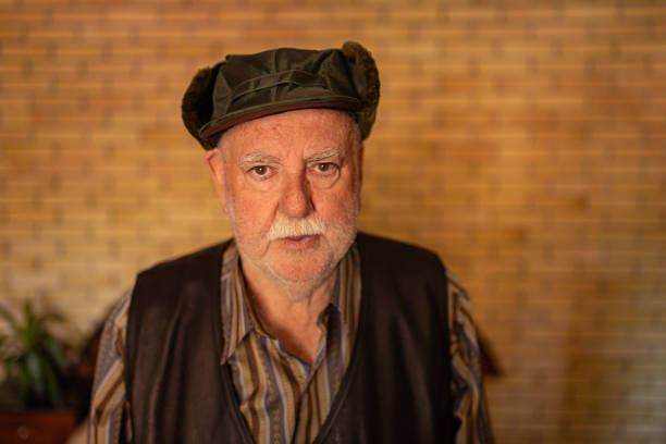 istock Portrait of an old man with a cap 1397933489