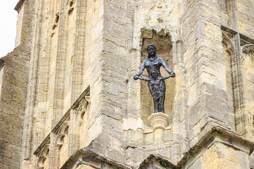 View of the new The Virgin and Child bronze statue, erected on the exterior of St John the Baptist Church, Cirencester in August 2021, replacing those removed back in the 1960's