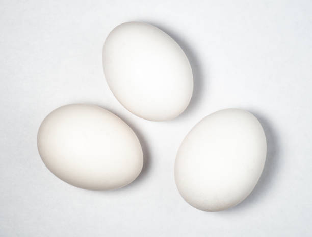 istock Three eggs on a white background. Cooking. Breakfast preparation. Healthy diet. 1397933707