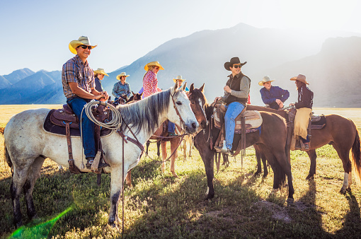 A group of friends on horseback at a ranch in Utah, USA.
