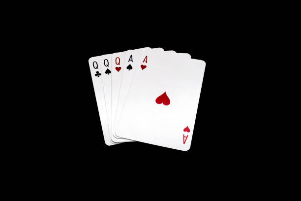 istock Full House poker hand isolated on black background 1397934868