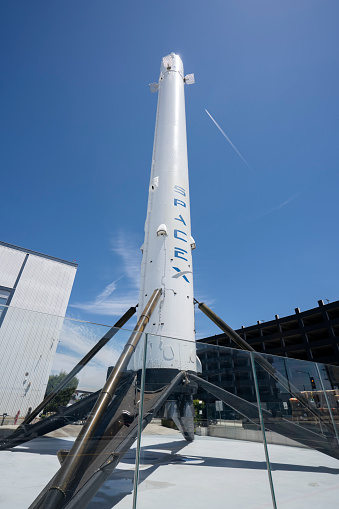 Hawthorne, CA, USA - May 10, 2022: The historic flown and recovered Falcon 9 rocket booster, a permanent vertical display at the SpaceX headquarters in Hawthorne, California.