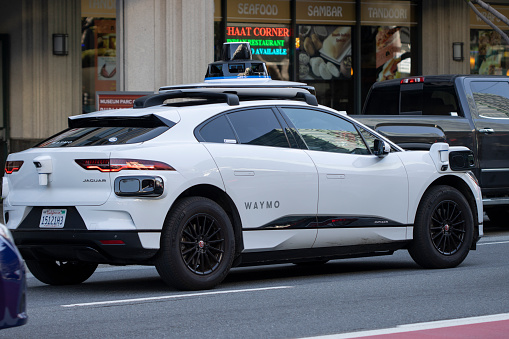San Francisco, CA, USA - May 1, 2022: Waymo's self-driving Jaguar I-Pace electric car is seen on the streets in San Francisco, California. Waymo and Jaguar Land Rover is working on a long-term strategic partnership.