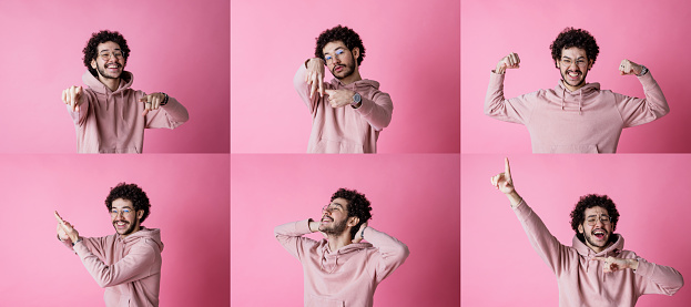 A composite image of portraits of a young man wearing a hoodie and eyeglasses while doing different poses to the camera. He is standing in front of a pink background.