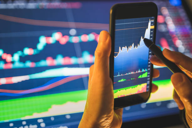 istock Asian Genration Y Young Investor using smart phone buying cryptocurrency through a mobile app and analysis with chart 1397937899