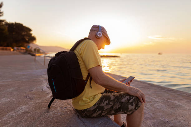 istock Tourist relaxing by the sea 1397938003