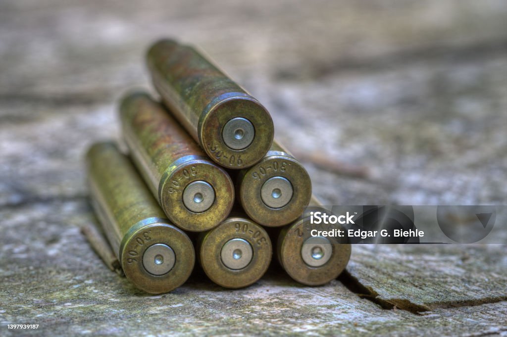 What's left at the end of the driven hunt are empty cartridge cases. At the end of the hunting season, the empty shell casings lying stacked to a small pyramid on the wooden board of the hunting pulpit. Bullet Stock Photo
