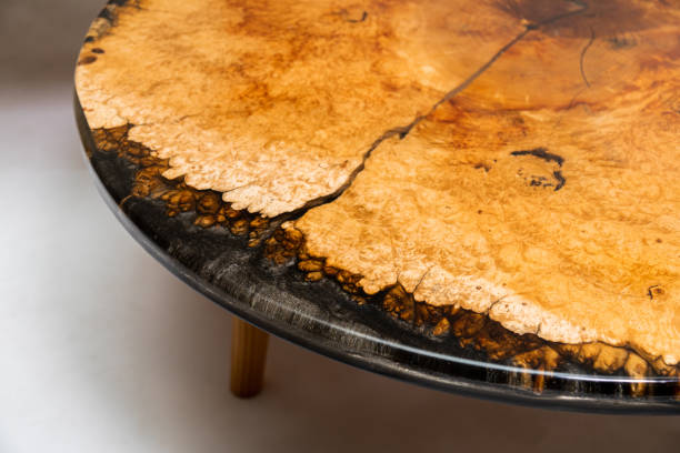 istock Closeup of epoxy resin round table edge on white background 1397940512