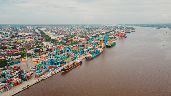 Aerial view from Dwikora port in Pontianak city is operating during the day. Seen loading and unloading activity there