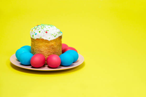 istock Easter cake and painted eggs on a yellow background, copy the place for the text 1397946266