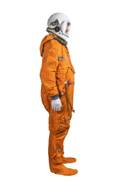 istock Astronaut wearing orange space suit and space helmet isolated on a white background. Side view 1397952226