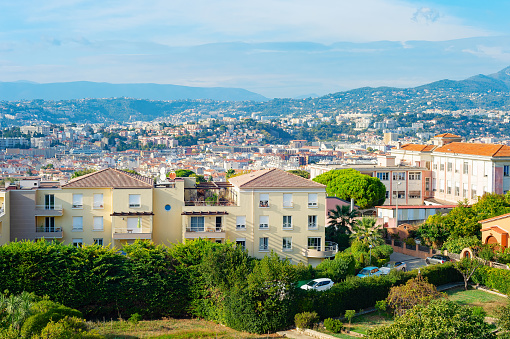 Scenic Nice cityscape with mountains view in bright sunlight, France