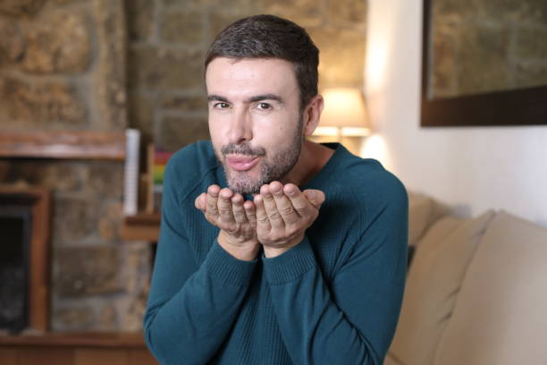 istock Very cute man blowing kisses 1397955902