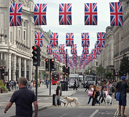 Patriotic British union Jacks flags in London's Regent Street for teh beginning of teh Queen's Platinum  Jubilee  celebration of 70 years on the throne