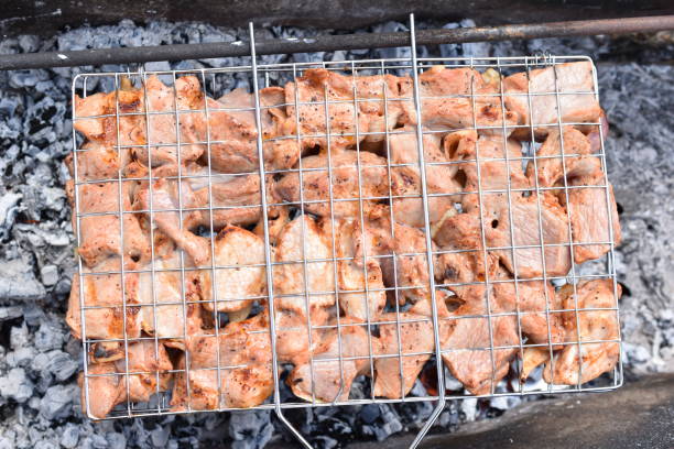 istock Grilled pork meat in a barbecue net with spices 1397959036