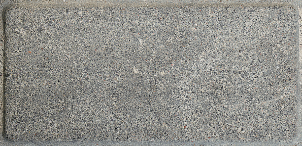 Concrete surface on the floor. Raw and rough surface, grainy light gray pattern with original textured effect.