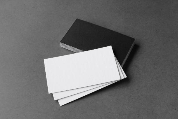 istock Business card on black background. 1397960614
