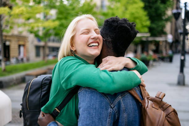 istock Happy diverse couple walking around the city 1397960737