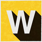 buchstabe-w-symbol-mit-langem-schatten-auf-strukturiertem-gelbem-hintergrund.jpg?b=1&s=170x170&k=20&c=arr8dirT1IUgQhV4AhIMwB2zwHt5DkmnnBeBKlRqOk8=