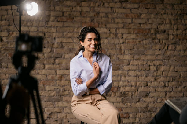 istock Young woman giving an interview in a studio 1397962069
