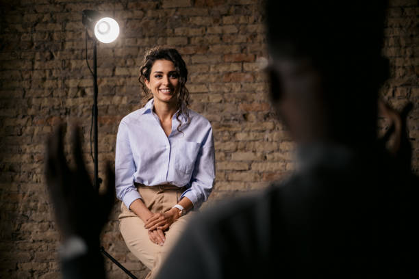 istock Attractive woman giving an interview in a modest studio 1397962073