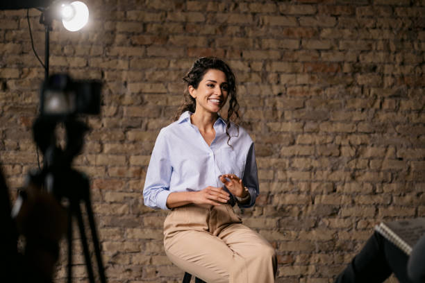 istock Young woman giving an interview in a studio 1397962075
