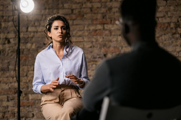 istock Young woman giving an interview in a studio 1397962081