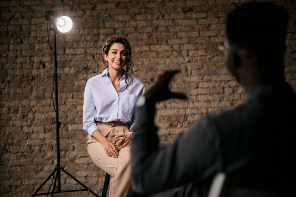 istock Attractive woman giving an interview in a modest studio 1397962120