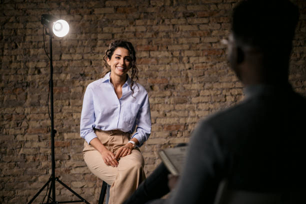 istock Attractive woman giving an interview in a modest studio 1397962132