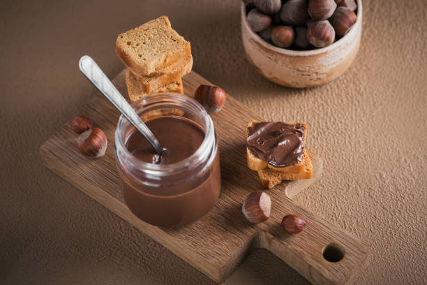 istock Little Toasts with sweet chocolate spread for breakfast. 1397962359