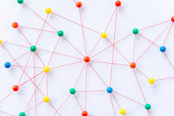 istock Linking entities, Blockchain, social media, Communications Network, The connection between the two networks. Network simulation on paper linked together by yarn 1397963486