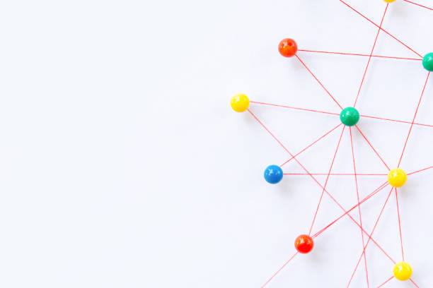 istock Linking entities, Blockchain, social media, Communications Network, The connection between the two networks. Network simulation on paper linked together by yarn 1397963625