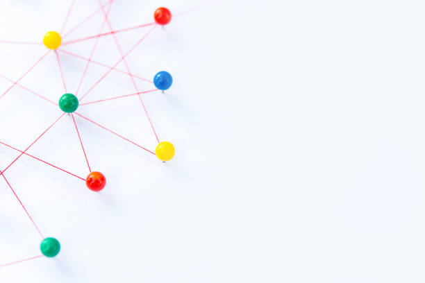 istock Linking entities, Blockchain, social media, Communications Network, The connection between the two networks. Network simulation on paper linked together by yarn 1397963663