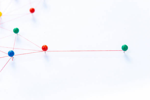 istock Linking entities, Blockchain, social media, Communications Network, The connection between the two networks. Network simulation on paper linked together by yarn 1397963673