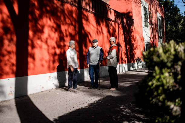 istock Three senior men standing on the street and talking 1397965198