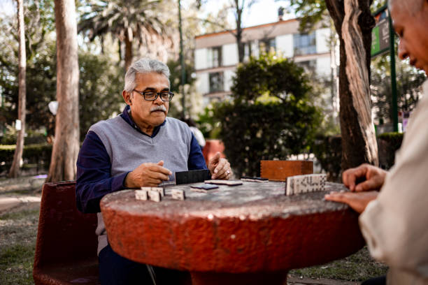istock Two senior men playing domino 1397965216
