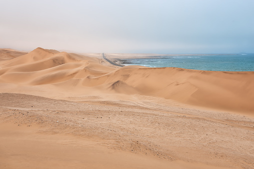 connection road between Swakopmund and Walvis Bay with the atlantic ocean and the namib desert