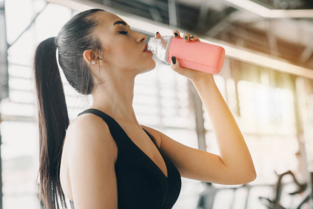 istock Enjoying some refreshment after gym. Woman at gym. 1397965654