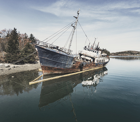 Old abandon wooden fishing boat on the Magdalen Islands
