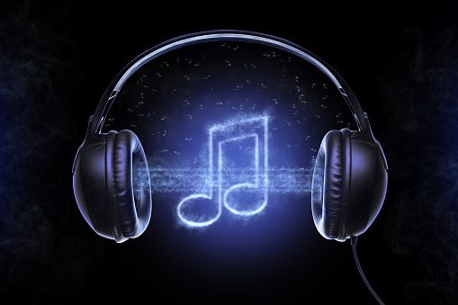 Black musical headphones, and also musical notes shrouded in a mysterious fog with bluish glowing