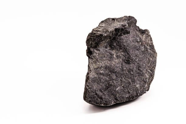 Dark grey gneiss on yellow background.