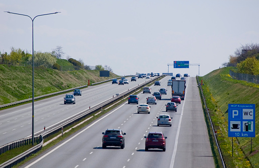 Poznan, Poland - May 1th 2022 - Polish A2 three-lane motorway with cars and trucks.