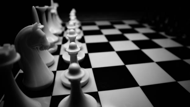 istock White and black chess pieces on a chessboard black and white photography 1397968605
