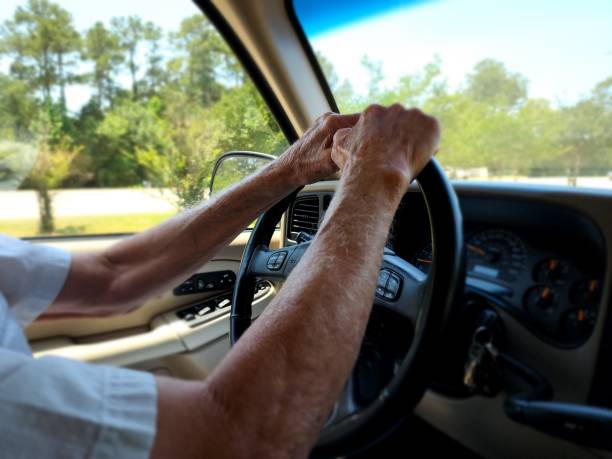 istock Transportation.  Man driving vehicle on spring day. 1397969167