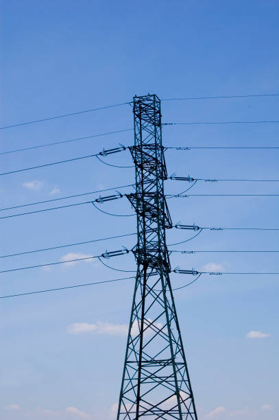 istock High voltage transmission tower over blue sky. 1397969230